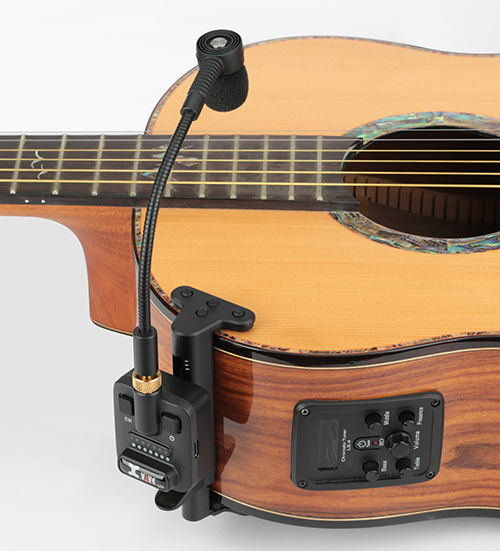 XVIVE U8 wireless mic clamped to an acoustic guitar body